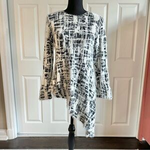 Reverse Black and Ivory Fuzzy Sweater with Asymmetrical Peplum